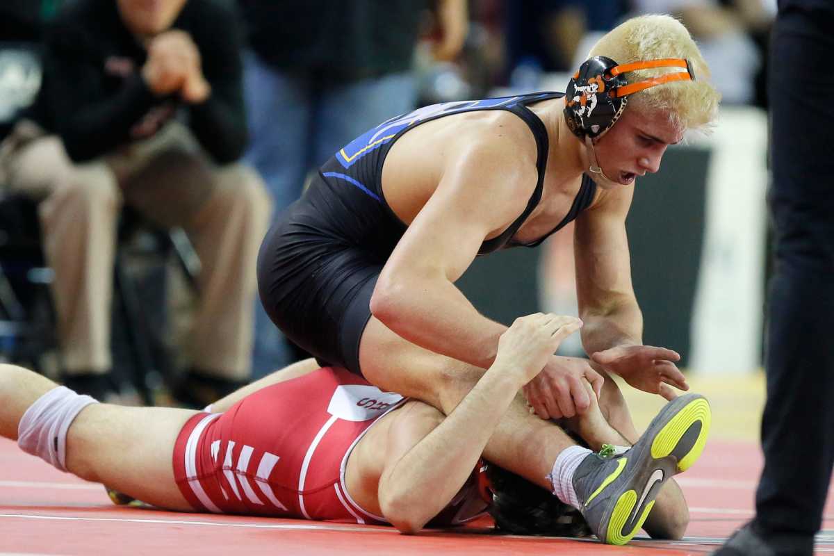 Angelo Ferrari, top, won the Oklahoma state wrestling tournament as a sophomore. He is committed to Iowa.