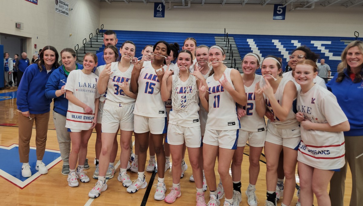 Lake girls basketball players and coaches celebrate winning a share of the Federal League championship with a win over GlenOak on February 3, 2024.
