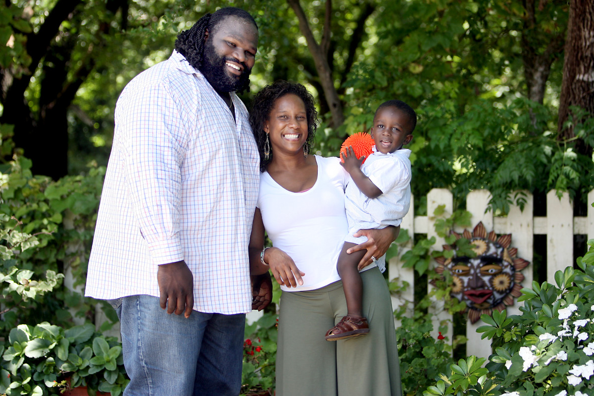 Mark Henry poses with his wife, Jana Perry-Henry, and their son, Jacob Henry, 20 months, in 2007. Jacob committed to wrestle at University of Oklahoma on Sunday.