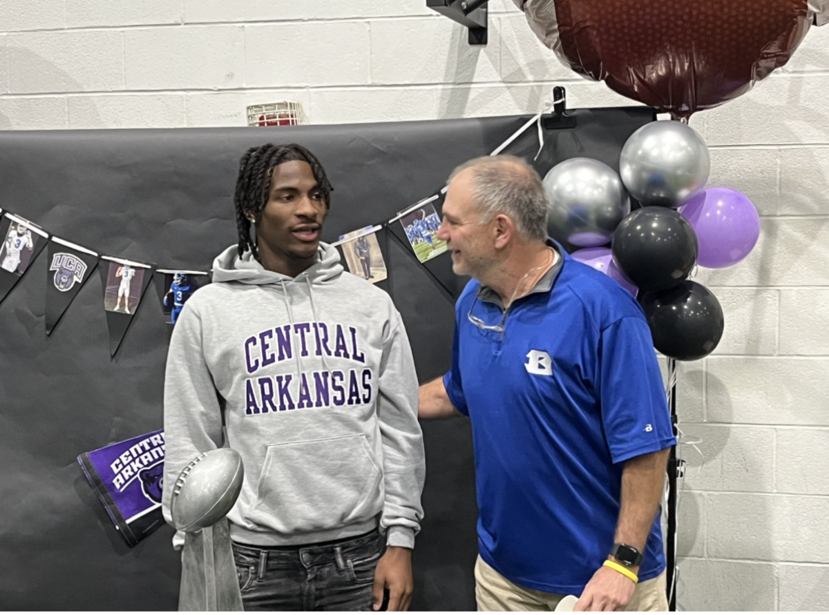 Mytorian Singleton (right) started at receiver for three seasons for Bryant and made some historic catches as BHS won two state titles and three conference titles during his career. (Photo by Nate Olson)