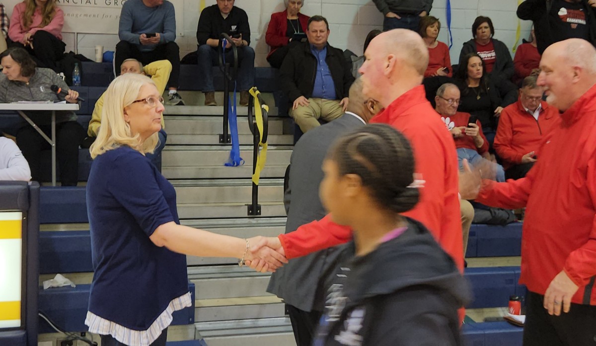 Archbishop Hoban head coach Pam Davis and Wadsworth head coach Andy Booth shake hands after a game on February 14, 2024