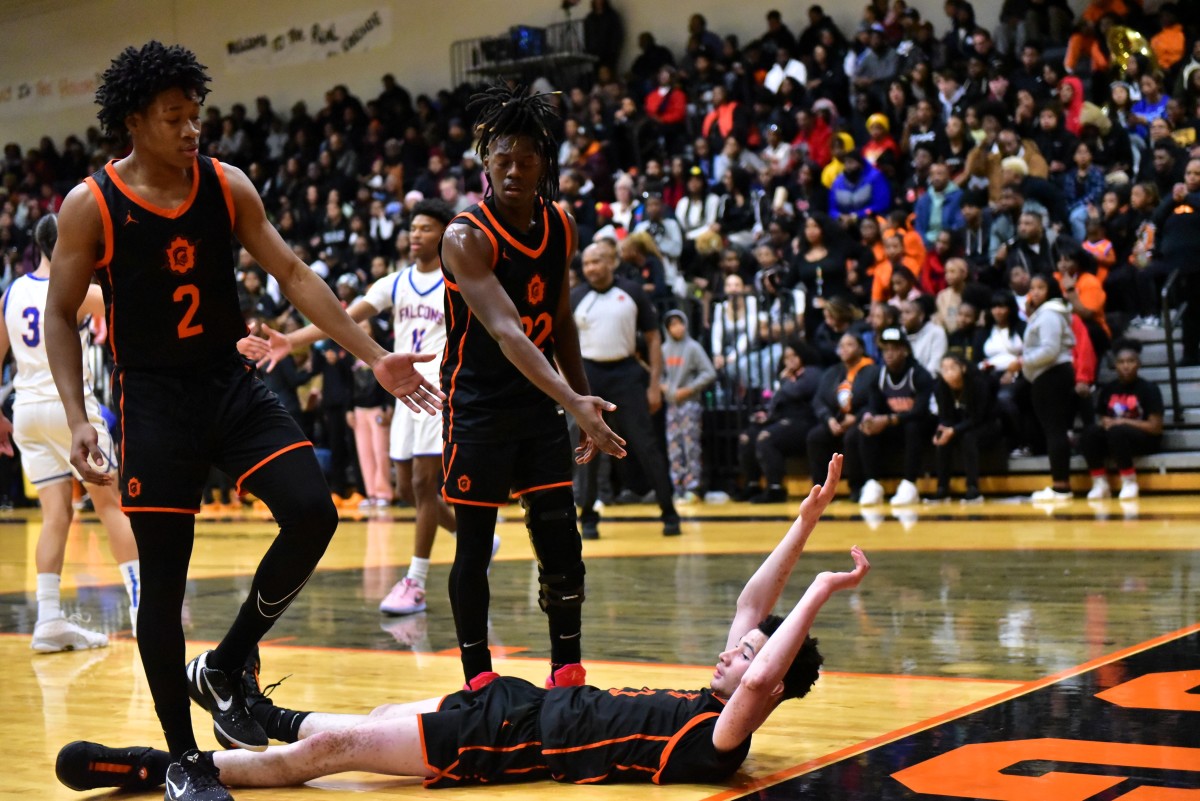 Oklahoma City Douglass junior guard Jaden Williams (right) has become an emerging force for a Trojans squad seeking to repeat as Class 4A state champions.