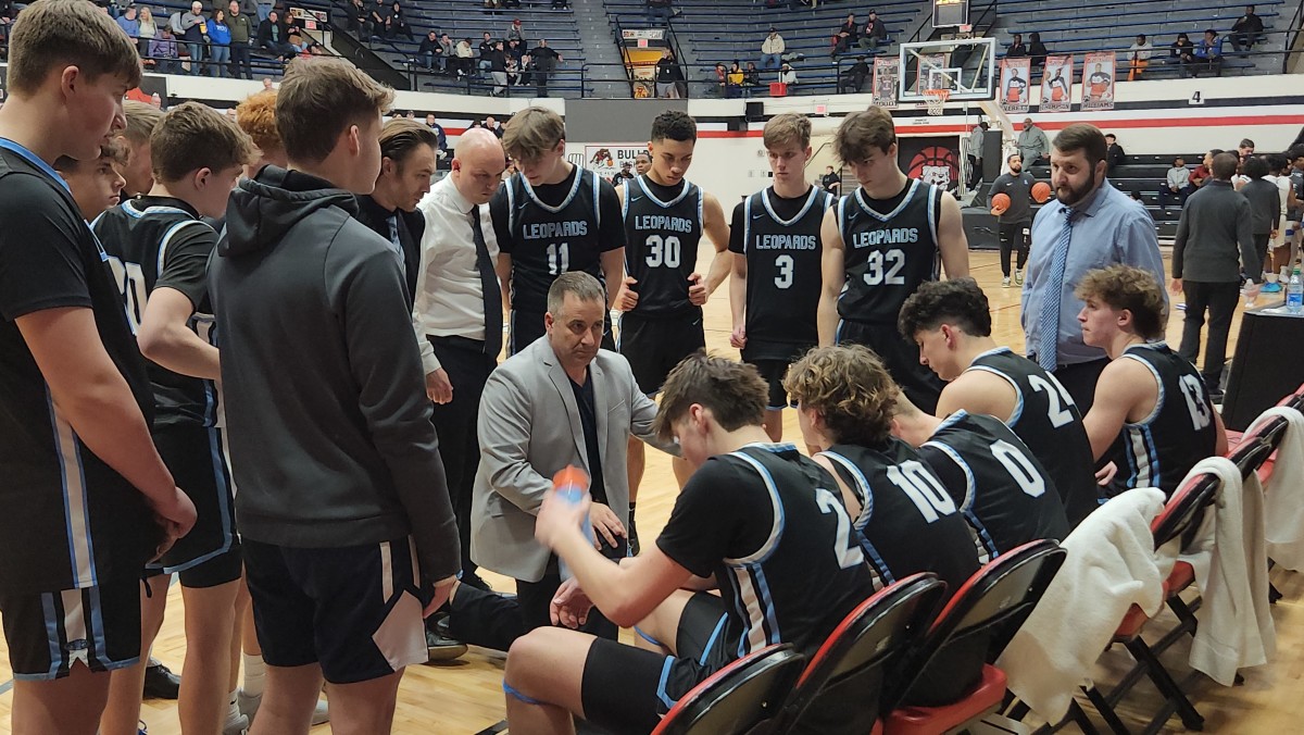 Louisville head coach Tom Siegfried talks to his team before the second half of their game against Lutheran East on Februray 17, 2024.