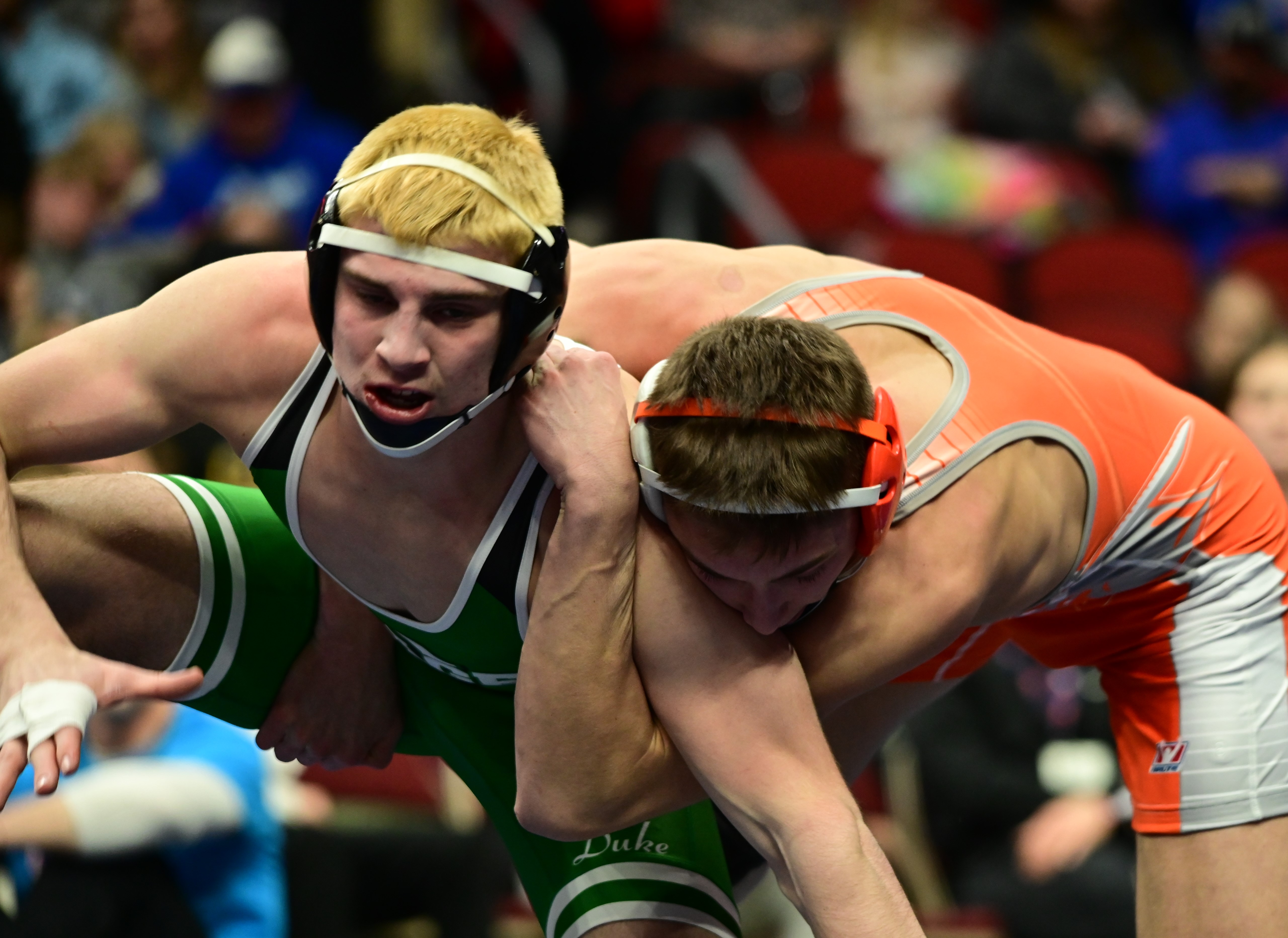 Tucker Stangel of Osage (left) tries to escape the hold of Sergeant Bluff-Luton's Bo Koedam during the Class 2A 157-pound state championship match at the Iowa high school state tournament at Wells Fargo Arena in Des Moines on Saturday. (Photo by Ryan Timmerman)
