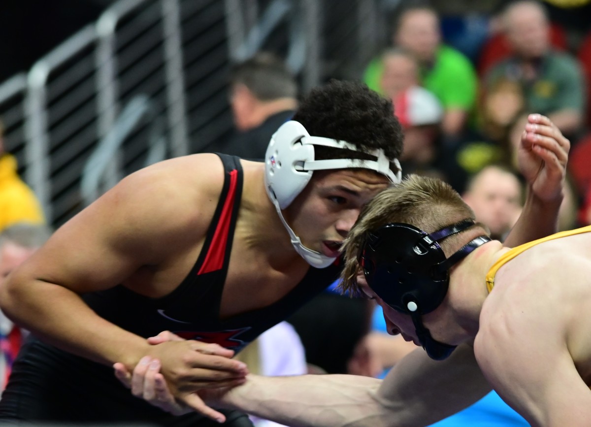 Damarion Ross of Fort Dodge (left) wrestles against Asa Hemsted of Carlisle (right) during the Class 3A 175-pound state championship match during the Iowa high school state tournament at Wells Fargo Arena in Des Moines on Saturday. (Photo by Ryan Timmerman)
