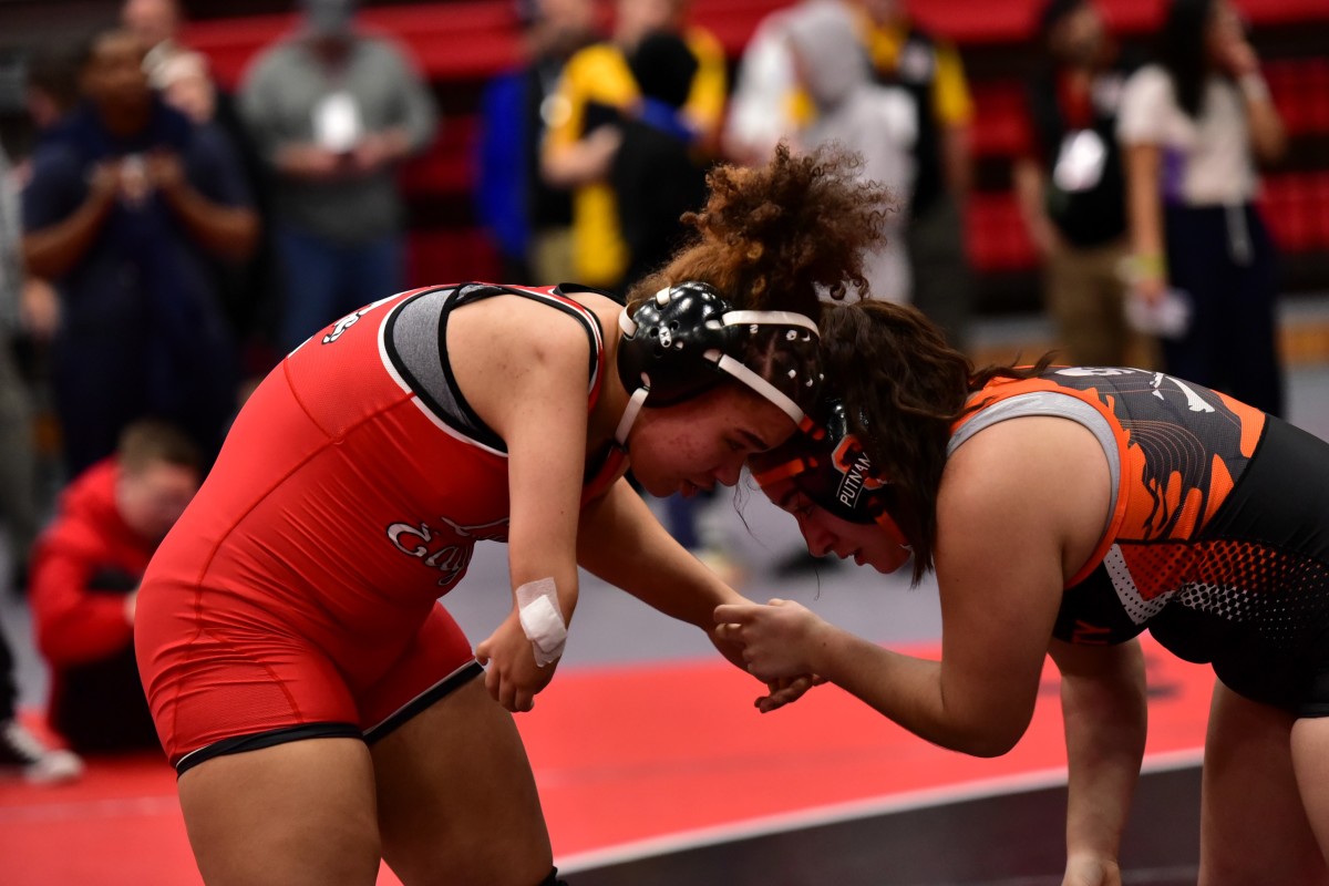 Del City sophomore wrestler Chloe Daniels competes in a recent match. She was born with a congenital limb difference in which her right arm is not fully formed.