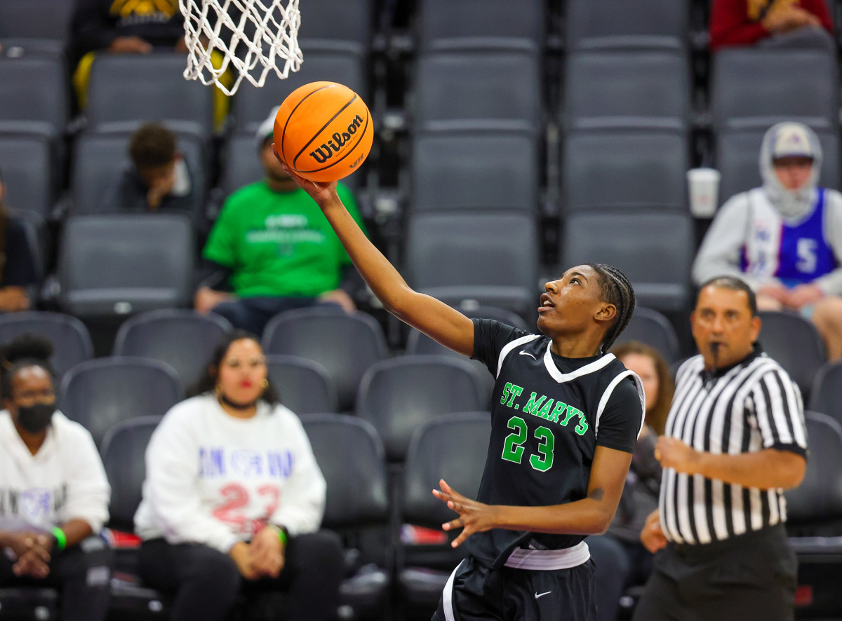 St. Mary's senior Emani King swoops in for two.