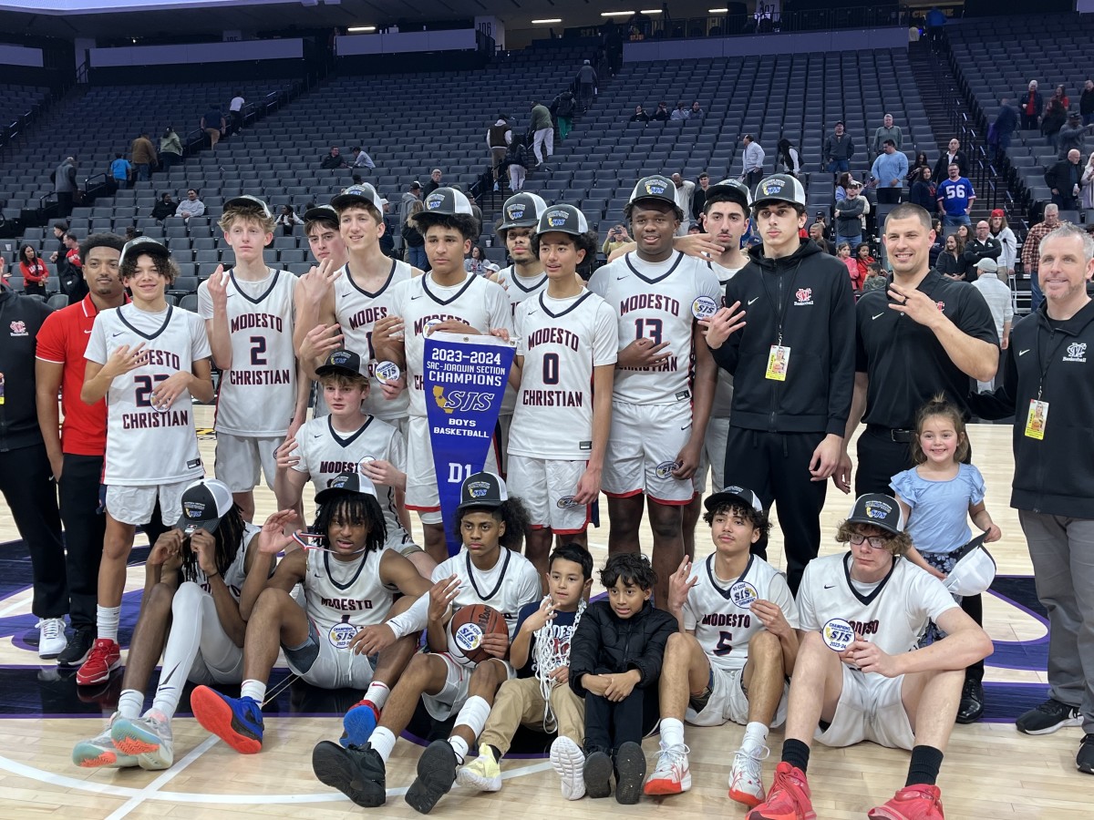 Modesto Christian celebrates then poses after 68-63 win over Lincoln for the Sac-Joaquin Section D1 championship at Golden 1 Center. 