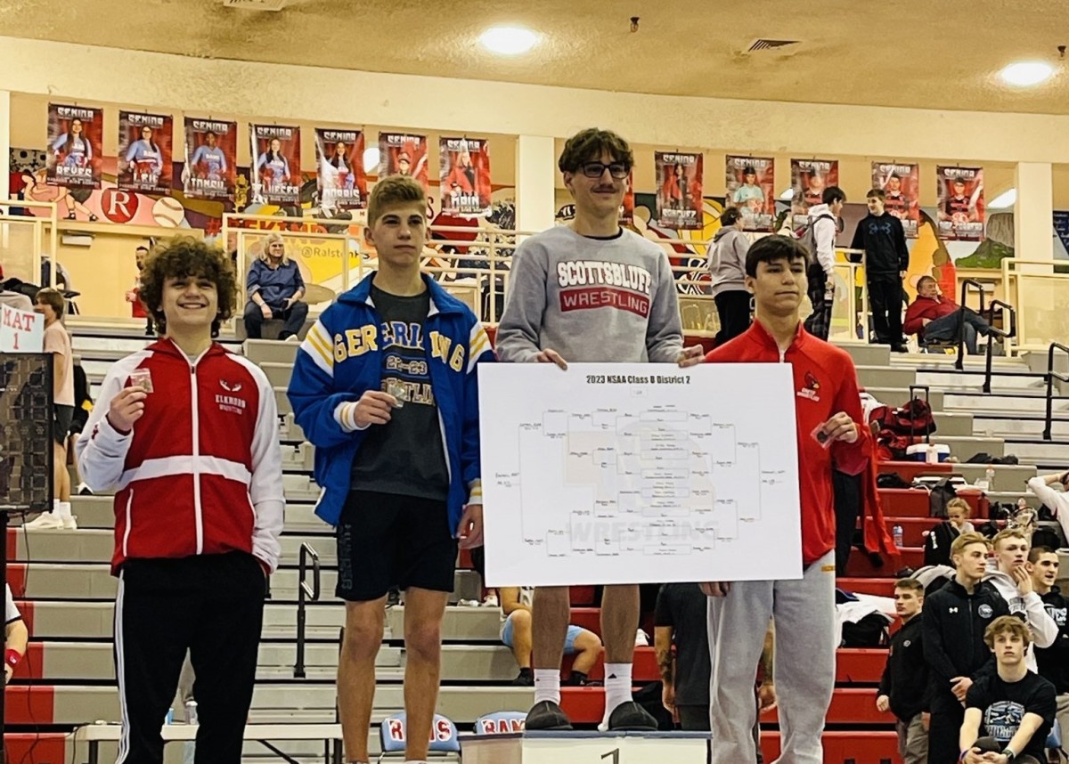 Scottsbluff senior Chance Houser stands atop the podium as the district champion earlier this season in Ralston. Houser is looking for a third straight state championship match and his first title as one of the best lightweight wrestlers in Nebraska. Photo from @kevingotgame15 on X.