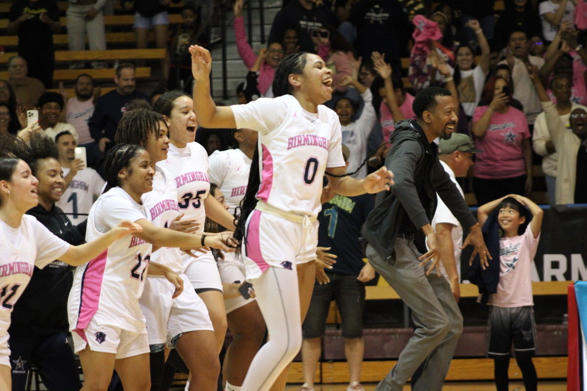 Birmingham Charter storms the court after the buzzer sounds, beating Westchester 55-50 in the City Section Open Division girls basketball finals at Pasadena City College on Saturday, Feb. 24, 2024.
