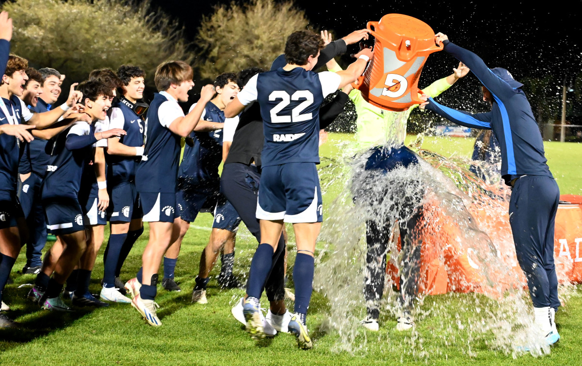 Gulliver Prep players drench their head coach Scott Davidson with a Gatorade bath after winning the Class 4A boys soccer state championship on Saturday at Lake Myrtle Park in Auburndale with a 1-0 win over Orlando Bishop Moore.