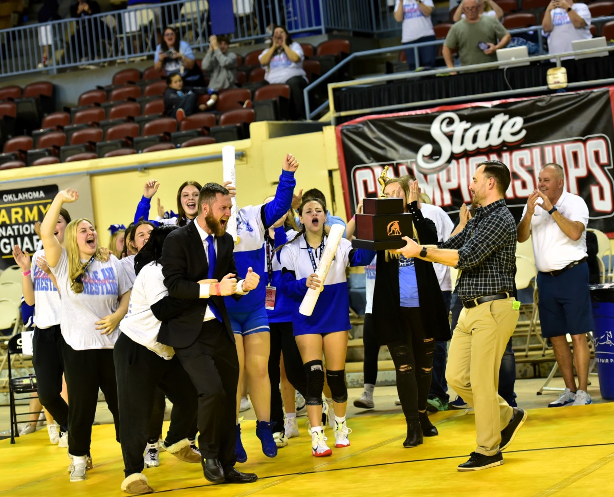 Little Axe wrestlers celebrate winning the Class 5A girls state championship on Feb. 24, 2024. It was the first team state title in program history for Little Axe.