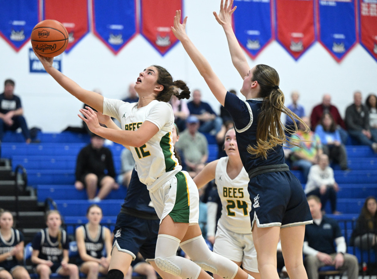 Medina's Olivia Klanac drives for a basket against Hudson in the OHSAA district semifinals on February 27, 2024.