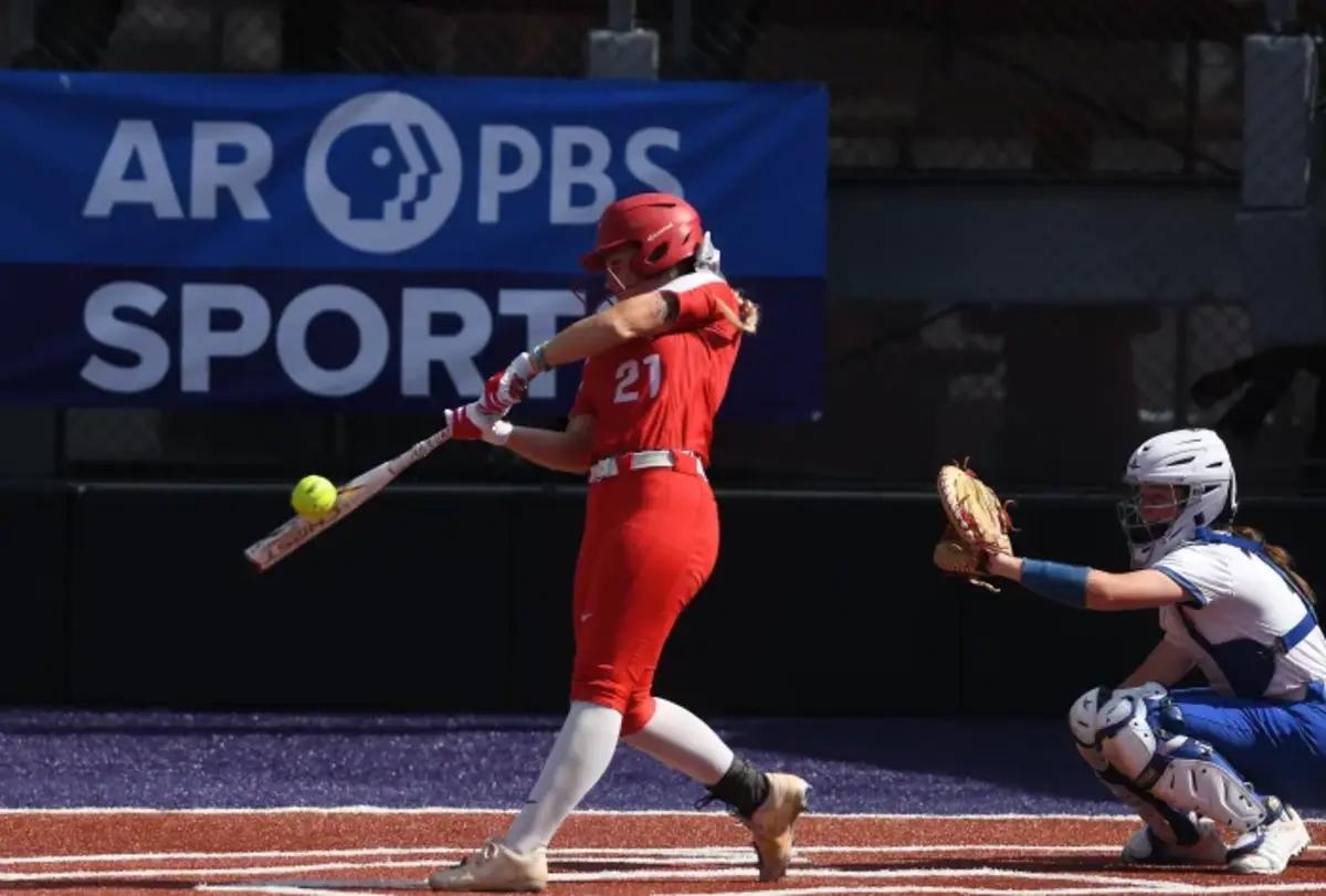 Akayla Barnard connecting on a ball with Abby Gentry catching behind her during the 2023 6A state final. (Photo by Jimmy Jones)