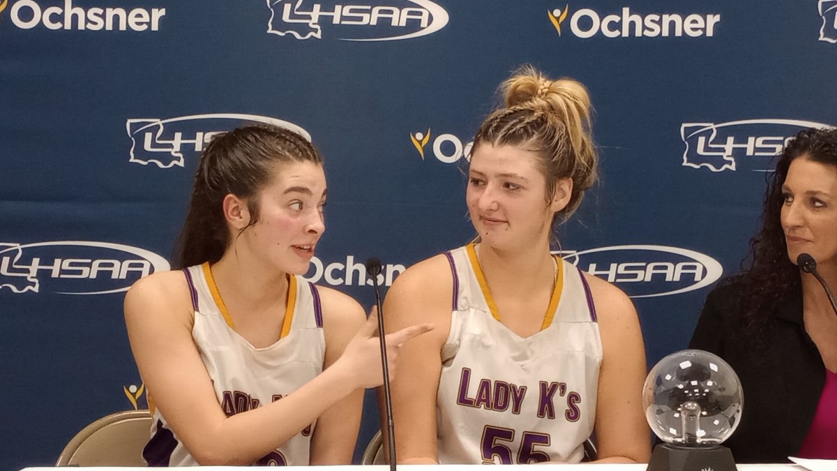 South Beauregard's Kaelyn Gunter (left) talks to head coach Susan Johnson (right) while teammate Emorie Fontenot looks on after the Lady Knights' Division II non-select semifinal victory Feb. 28, 2024. 
