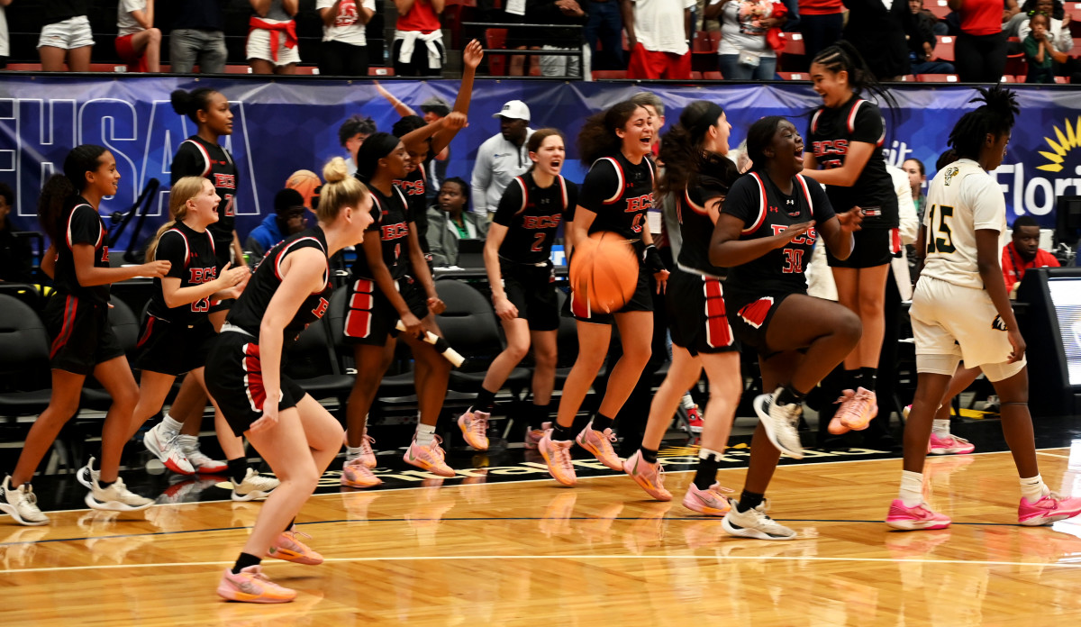 Evangelical Christian Academy players celebrate after winning the Class 2A girls basketball state championship on Thursday at the RP Funding Center in Lakeland.