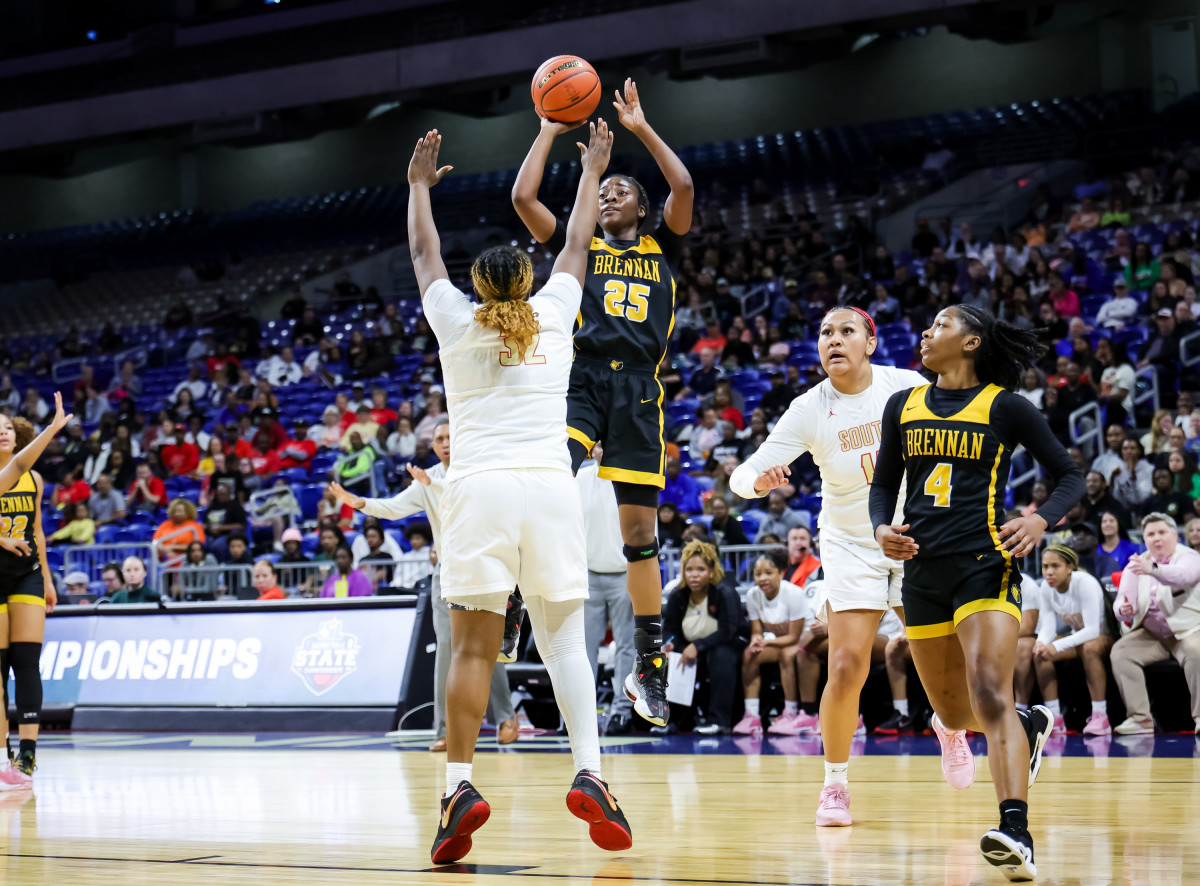 Mahogan Pierce releases a jumper over Cedra Peterson during the UIL Class 6A girls state semifinals on Friday night at the Alamodome.