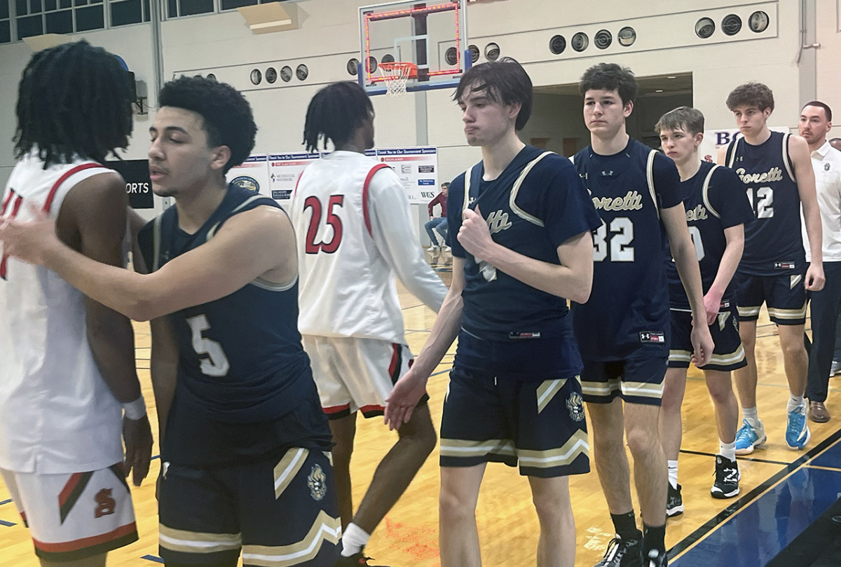 Members of the St. Maria Goretti boys basketball team shake hands with their counterparts from Archbishop Spalding after the Gaels dropped an 82-79 decision to the Cavaliers in the opening round of the 2024 Baltimore Catholic League basketball tournament. The loss will stand as the final game in the Goretti's storied basketball history as the school will close its doors for good at the end of the current academic year.