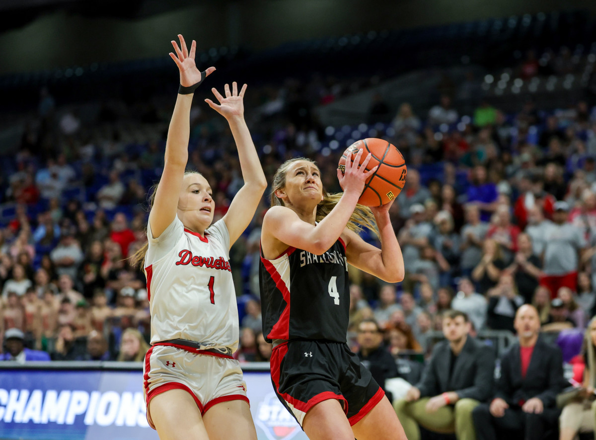 Huntington's Jesie Rogers contests a shot from Shallowater's Linley Wright in the Texas UIL 3A girls state basketball tournament on Saturday at the Alamodome.