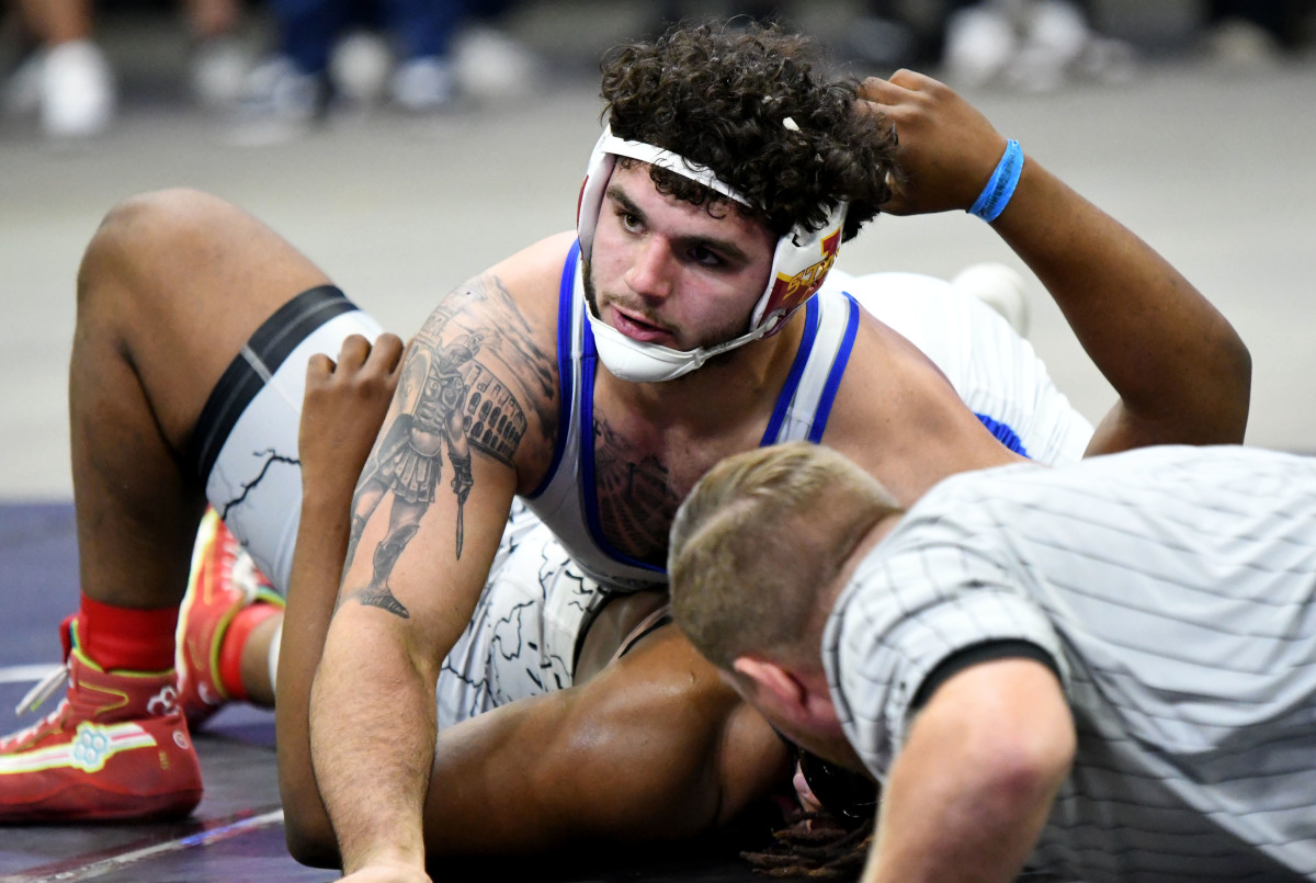 South Dade senior Sawyer Bartelt pins Dante DeSantis, from Dwyer, in the 215-pound state championship match on Saturday at Silver Spurs Arena in Kissimmee. 