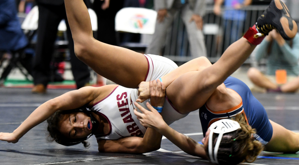 Lake Gibson senior Gabby Tedecso works her way to the girls 106-pound wrestling state championship on Saturday at Silver Spurs Arena in Kissimmee. It was the second straight state title of her career. 