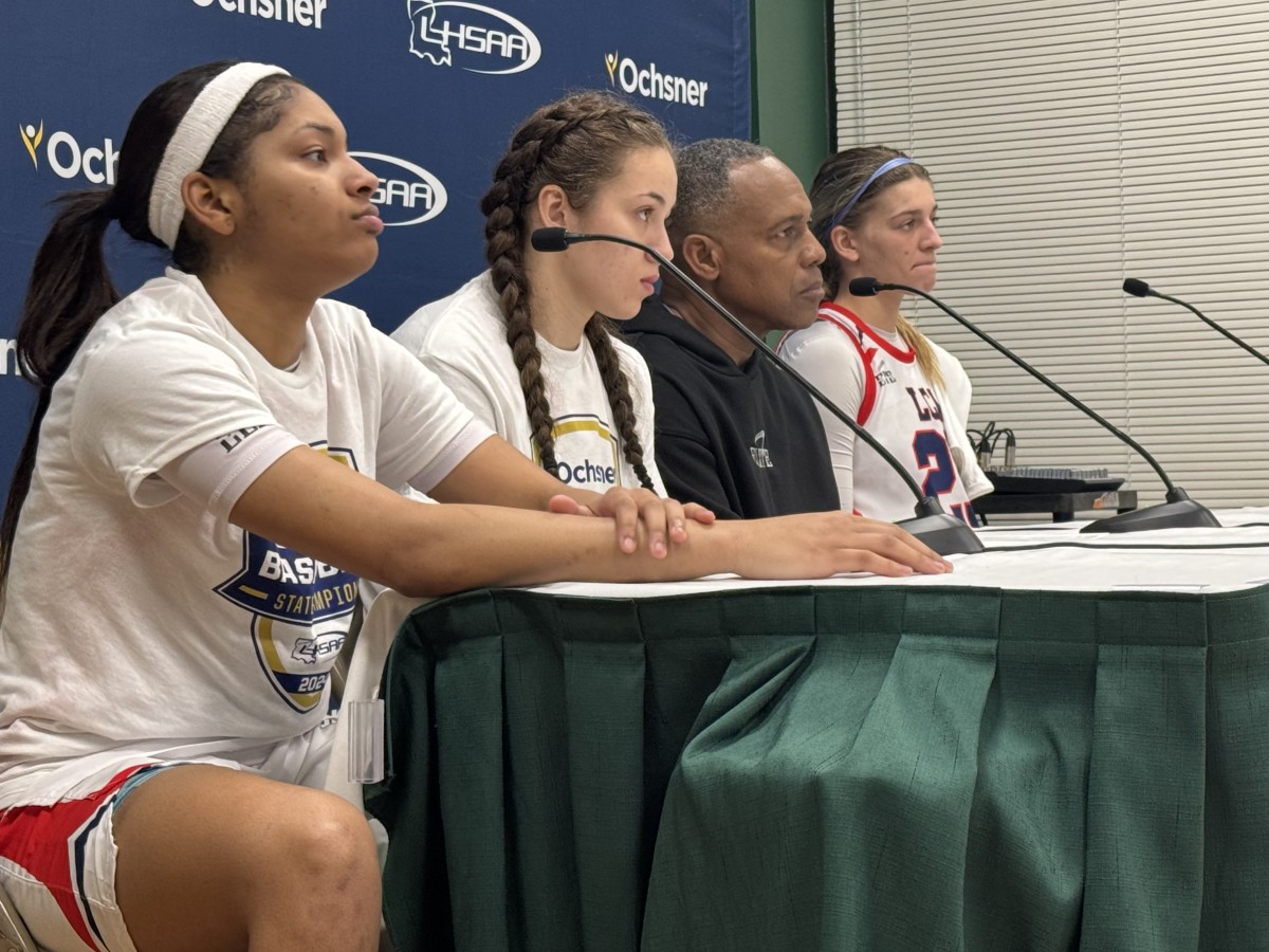 Lafayette Christian Academy players Jada Richard (from left), Indy Hebert, coach Errol Rogers and Eve Alexander listen to a question during the postgame press conference following the Lady Knights' Division II select championship game win on March 2, 2024.
