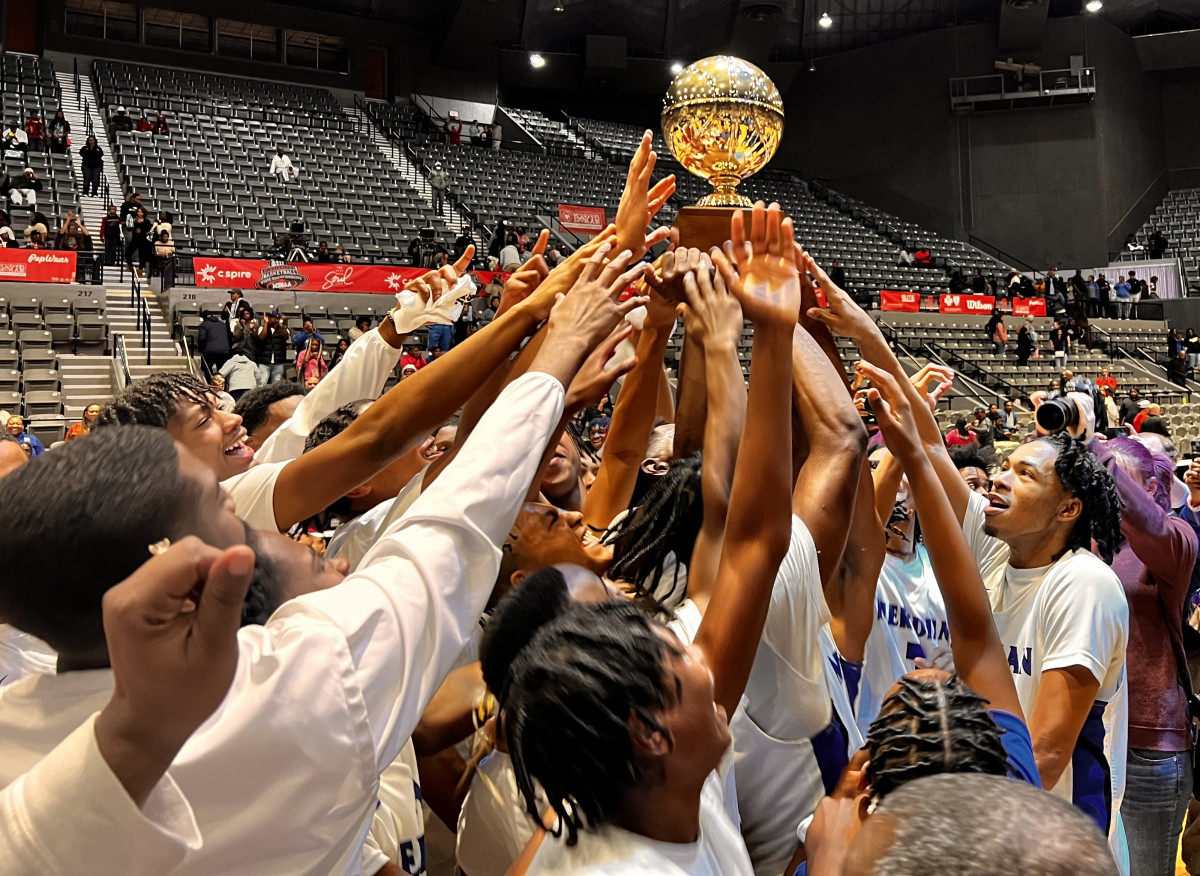 The Meridian Wildcats celebrate with the golden ball after winning the 2024 MHSAA Class 7A Championship with a 54-50 win over the Clinton Arrows on Saturday, March 2, 2024 at the Mississippi Coliseum in Jackson, Miss.