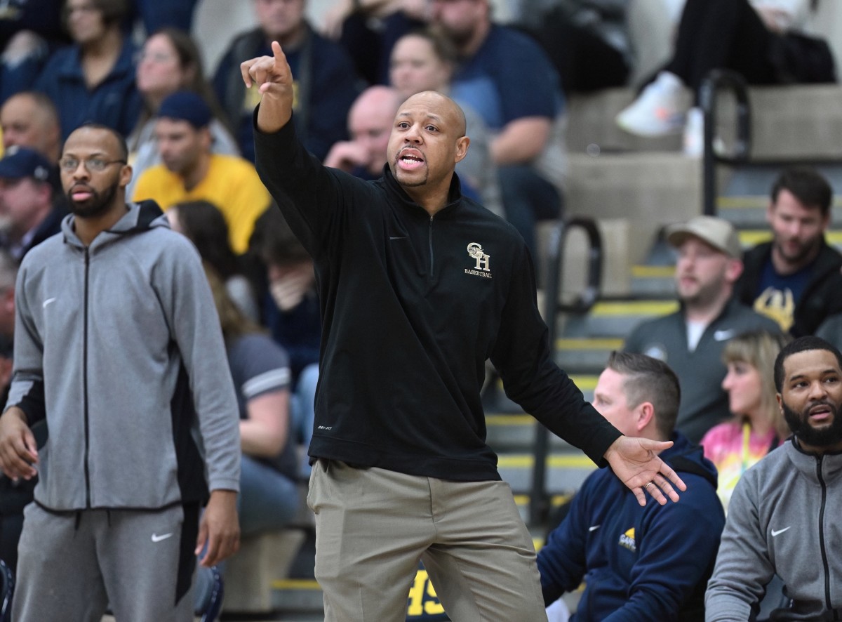 Garfield Heights head coach Sonny Johnson gives instruction to his team during. agame against North Ridgeville on March 1, 2023