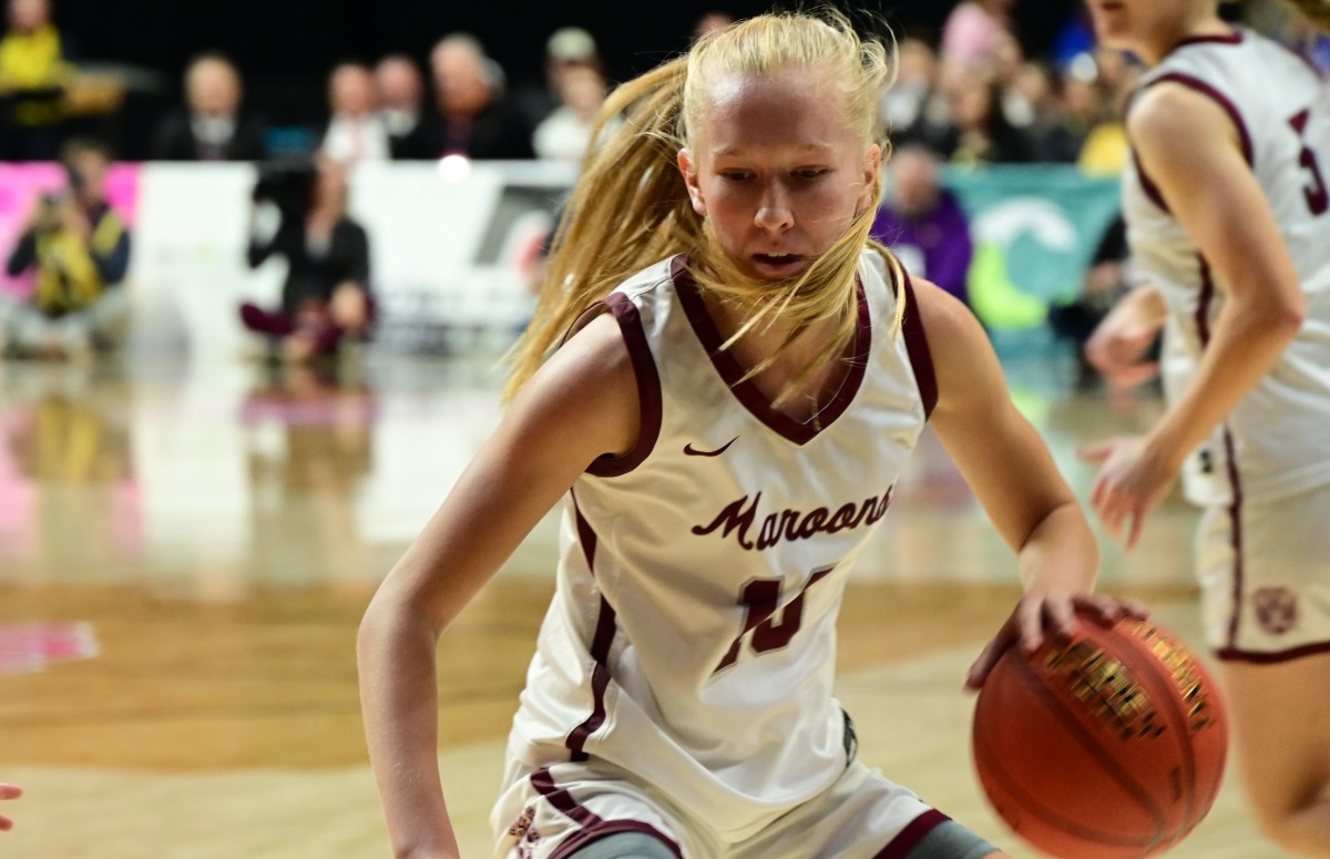 Dowling Catholic's Ava Zediker drives to the hoop against Cedar Falls during a Class 5A semifinal game against Cedar Falls at Wells Fargo Arena in Des Moines on Thursday. (Photo by Ryan Timmerman)