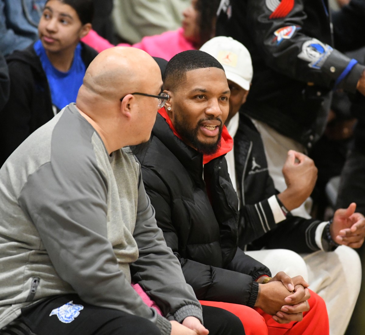Oakland alum Damian Lillard (middle) was amongst a packed house Tuesday at Oakland Tech, which recorded its fourth win of the season against the Wildcats.  