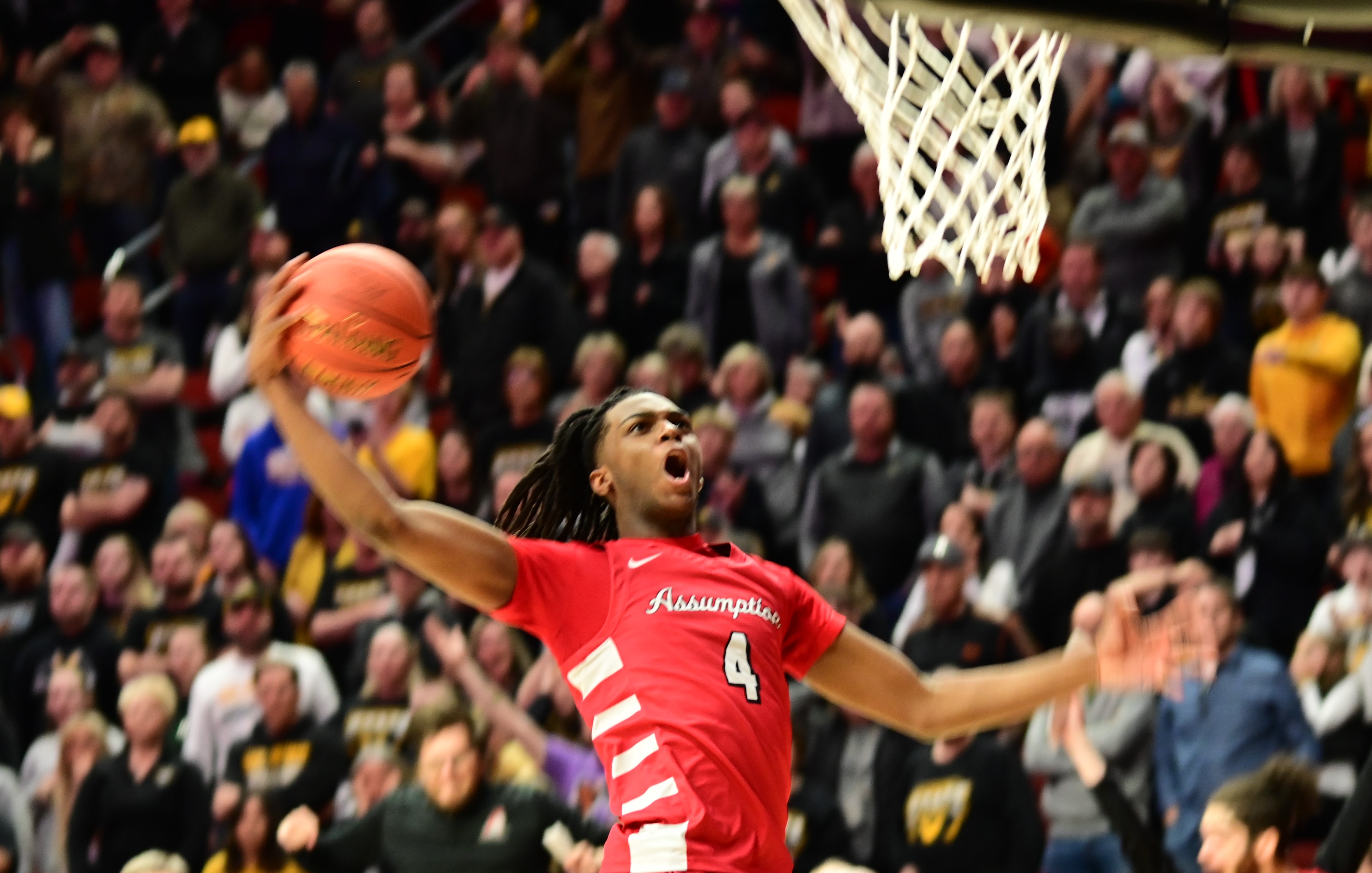 Davenport Assumption's Navon Shabazz goes up for a dunk during the Class 3A state championship game against Waverly-Shell Rock on Friday at Wells Fargo Arena in Des Moines. (Photo by Ryan Timmerman)
