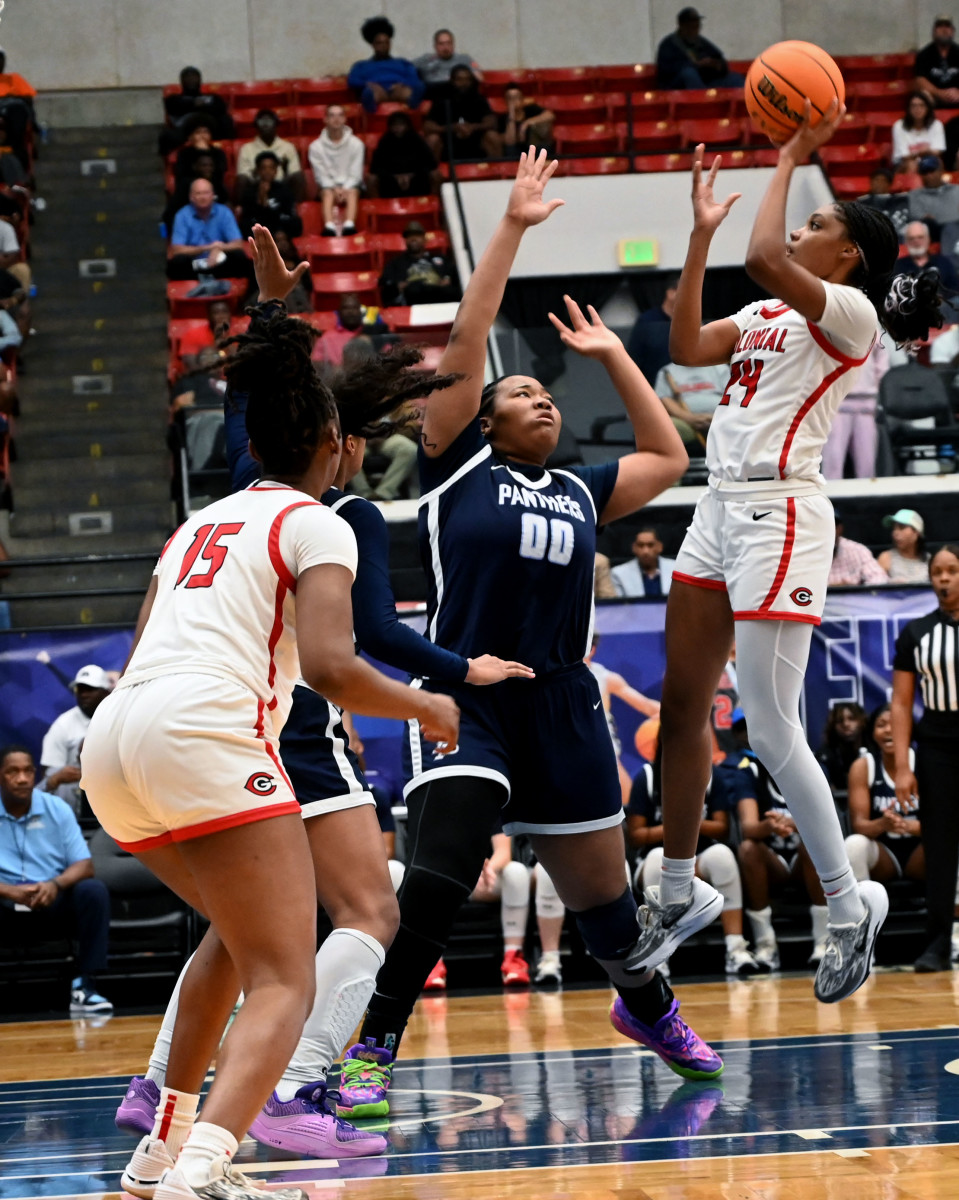 Colonial guard Jasmynne Gibson pulls up with a shot in the lane against Dr. Phillips during the FHSAA Class 7A girls basketball state championship game at The RP Funding Center Lakeland.