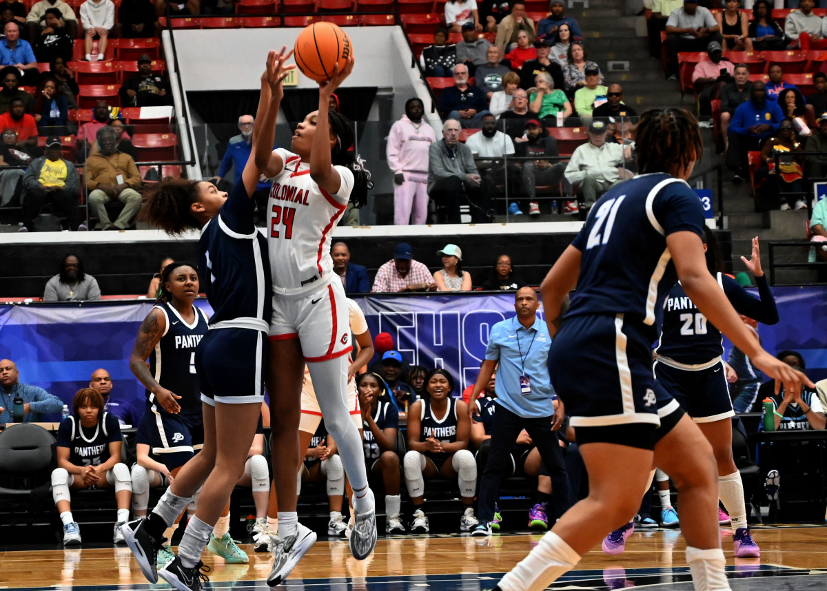 Colonial guard Jasmynne Gibson drives to the basket against Dr. Phillips during the FHSAA Class 7A girls basketball state championship game at The RP Funding Center Lakeland.