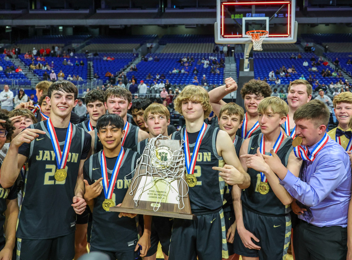 Jayton players pose with the UIL Class 1A state championship trophy after beating Benjamin Saturday morning.