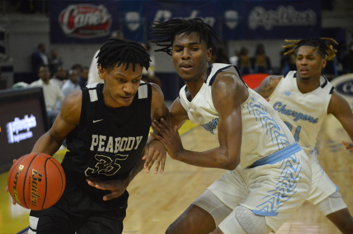 Peabody senior Zaydrien Sewell (35) tries to go in the paint against Madison Prep in the Division II select championship game March 9, 2024.