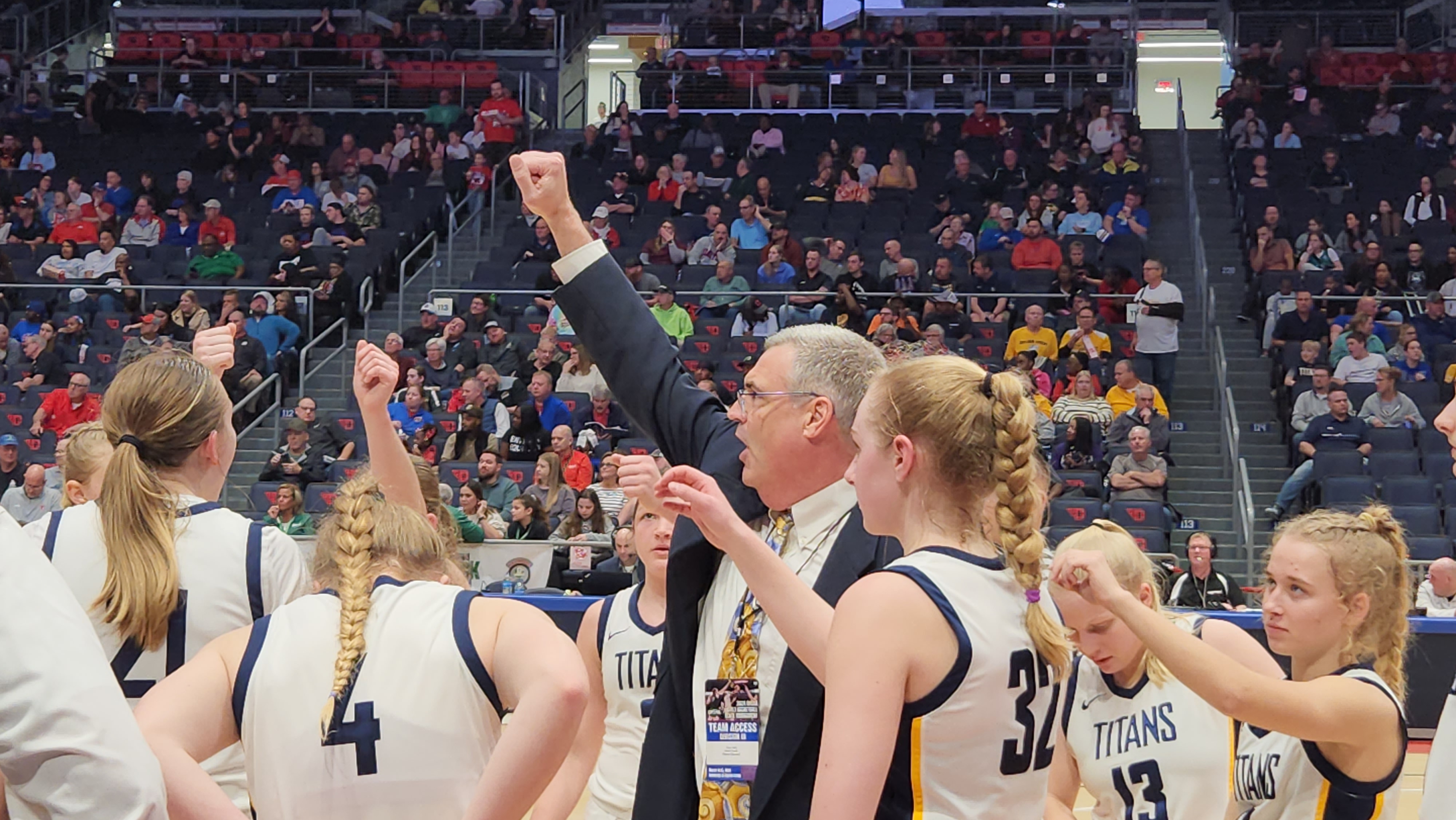 Ottawa-Glandorf breaks a huddle after a timeout during their Division III state semifinal game against Portsmouth on March 14, 2024.