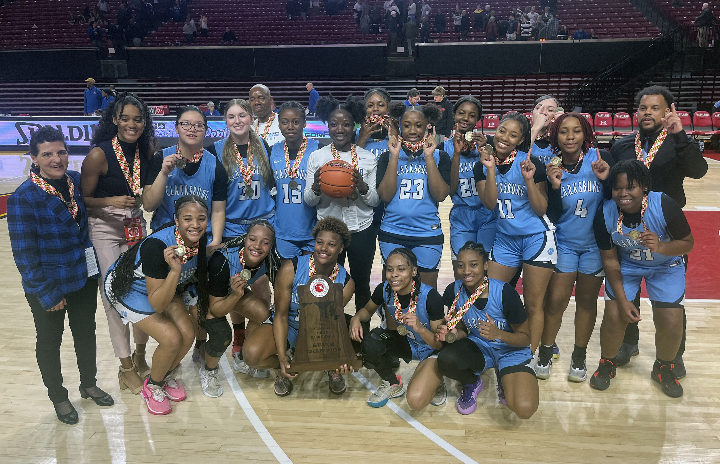 Clarksburg poses for a team photo with its first ever MPSSAA girls basketball state championship trophy.