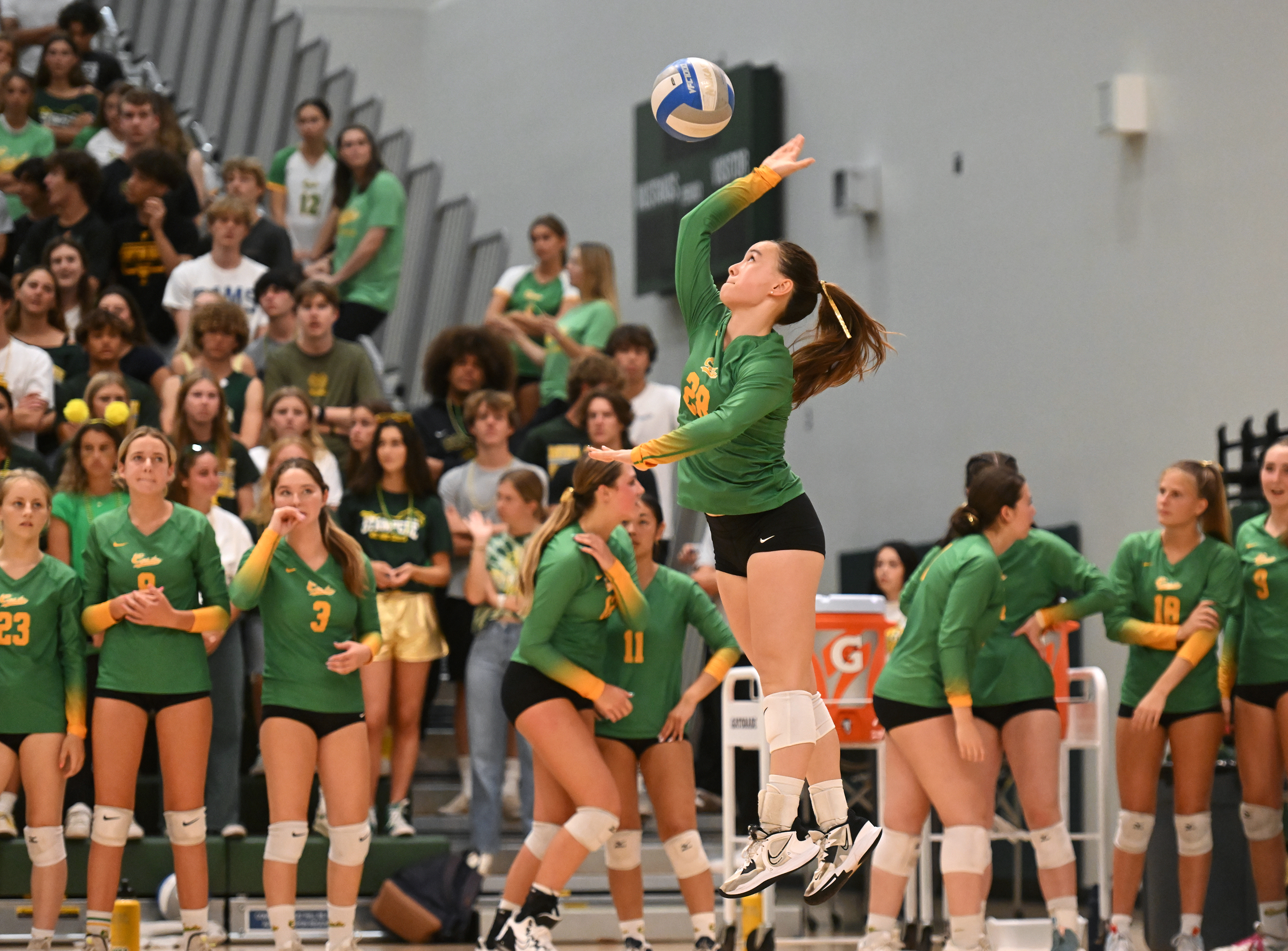 A jump serve from Trixie McMillin (28)