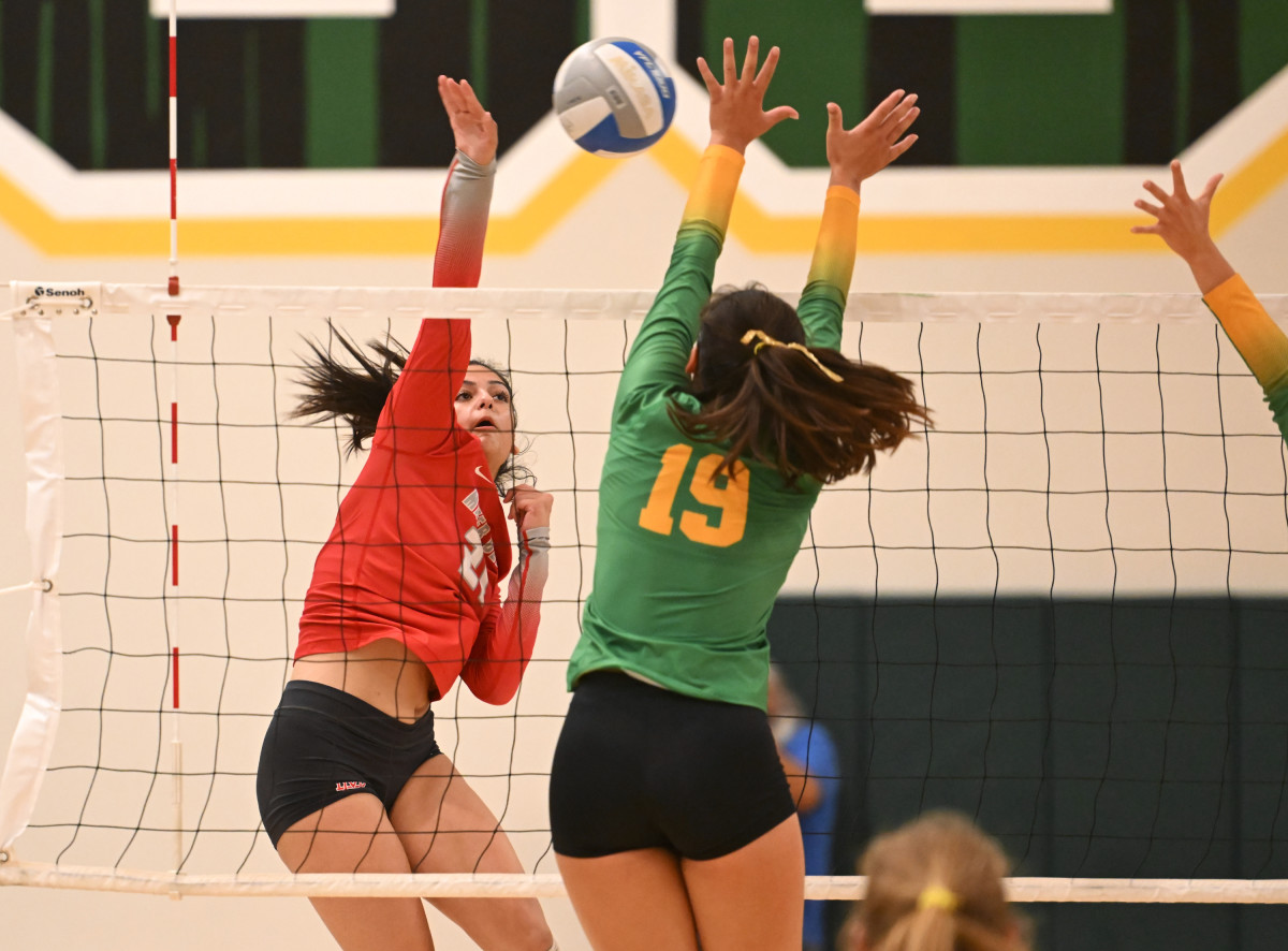 Hard-hitting action earlier this season when top seed Mater Dei (red) knocked off Mira Costa, 25-21, 25-21, 21-19