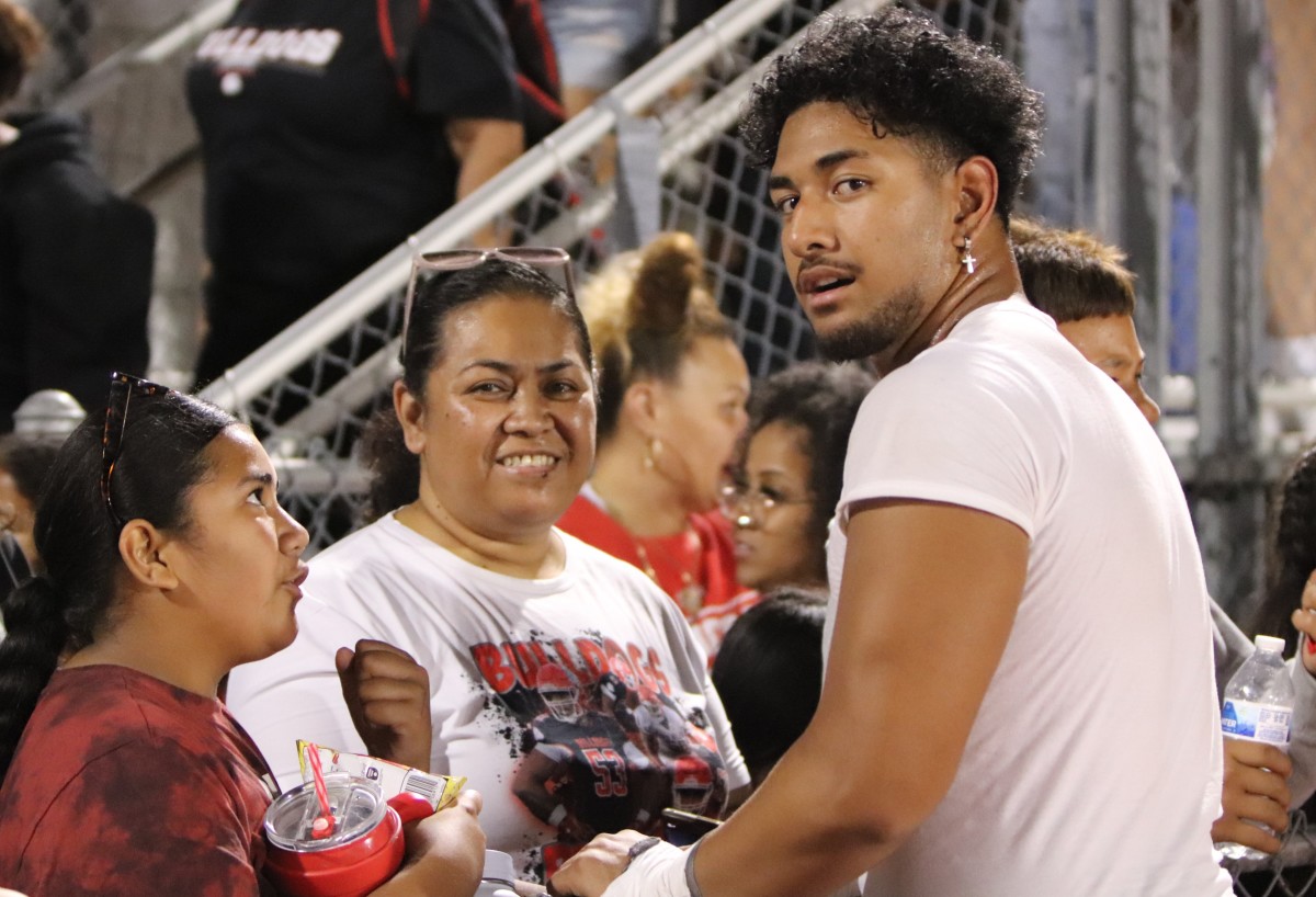 Paki Finau (right) and his mom Si’i (middle) after another big win. 