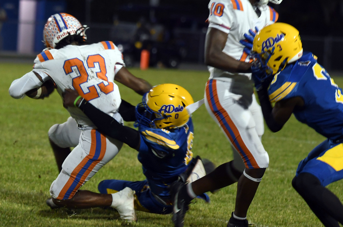  Bartow running back Dayrel Glover (23) is dragged down by an Auburndale tackler on Friday at Bruce Canova Stadium in Auburndale.