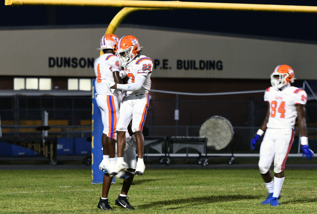 Bartow wide receiver Ka'marion Thomas (4) celebrates his 40-yard touchdown reception with an air-bump in end zone. He is joined by Dayrel Glover (23) and Dayton Ball (34).