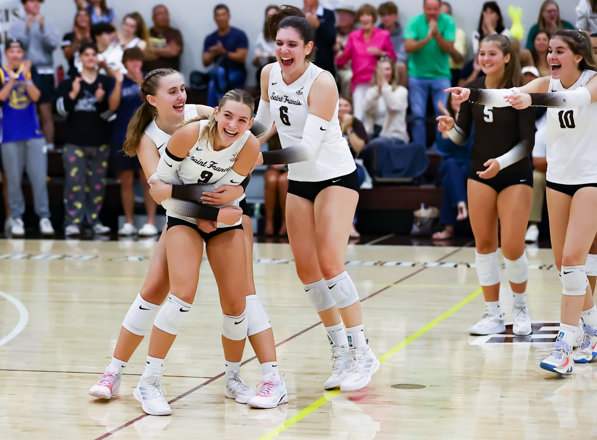 Jaemysen Martin (9), Erin Curtis (6), Sacha Touma (10) and Whitney Wallace (5) among the Saint Francis players celebrating during Wednesday's four-game home win over Mitty. Photo: Jim Malone