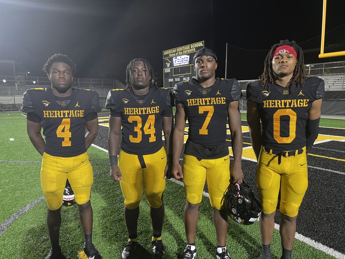 American Heritage handles Cardinal Gibbons, 48-7, on 9/29/2023. (From left) Deandre Desinor (4), Chance Washington (34), Byron Louie (7) and Omar Thornton (0).