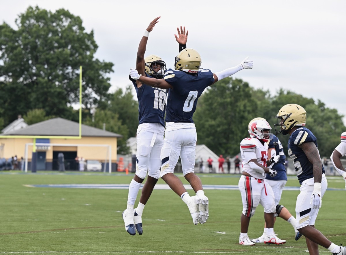 Archbishop Hoban's Tylan Boykin (No. 10) and Payton Cook (No. 0) celebrate a play against Akron East on Saturday, September 9, 2023. (Photo by Jeff Harwell)