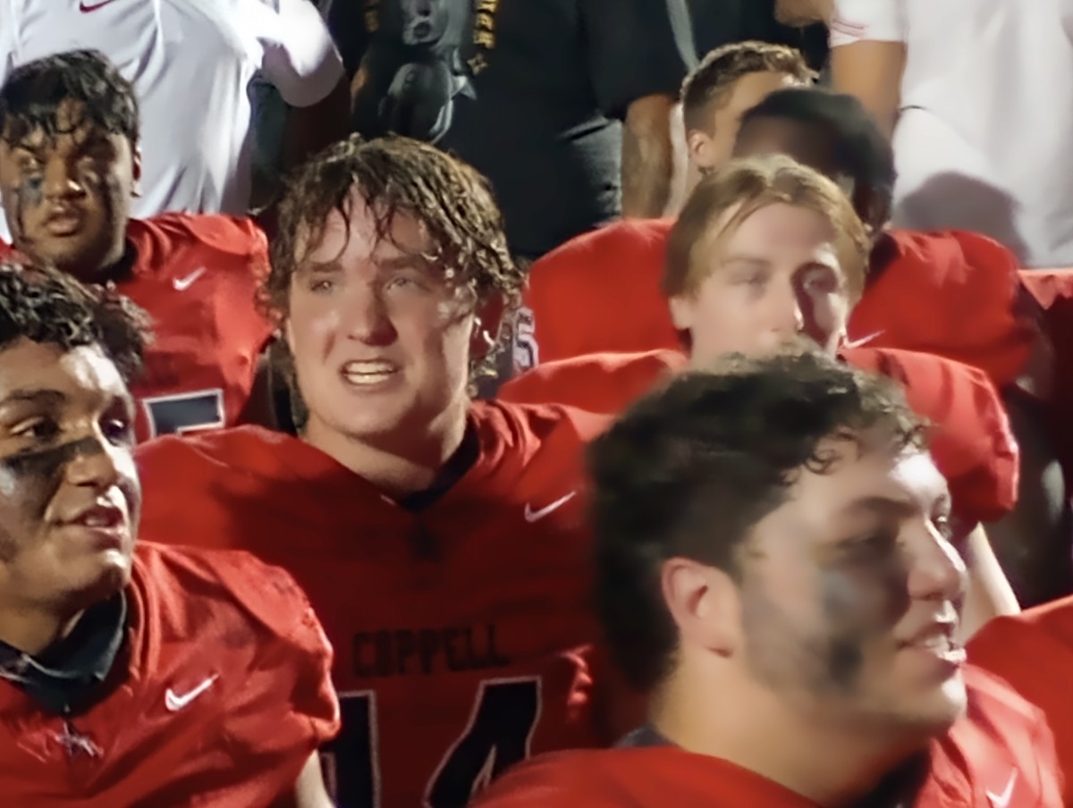 Coppell junior quarterback Edward Griffin celebrates with his teammates following the Cowboys' 49-28 win against Lewisville on Sept. 29, 2023.