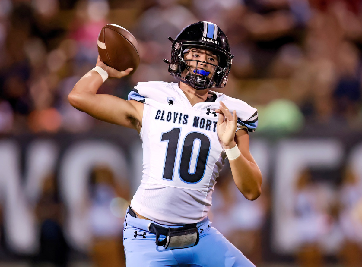 Clovis North quarterback Mario Cosma (10) connected on a 59-yard touchdown pass to Vincent Cordoba late to seal the victory. Photo: Bobby Medellin