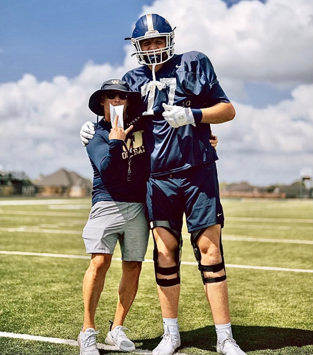 Bentonville West 6-foot-10 offensive tackle Lane Jeffcoat towers over Wolverines head coach Bryan Pratt. (Courtesy photo)
