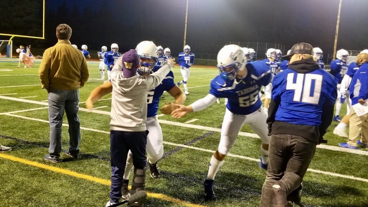 Tahoma equipment manager Wyatt Bureau, who has Down syndrome, scores staged touchdown against Federal Way.