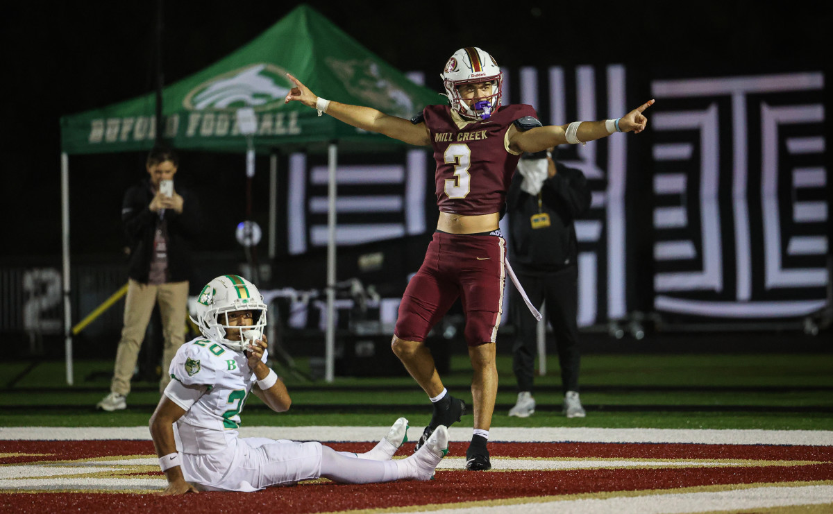 Mill Creek's Trajen Greco (3) celebrates a pass breakup against Buford's John Gibbons in the end zone. (Photo by Colin  Hubbard)